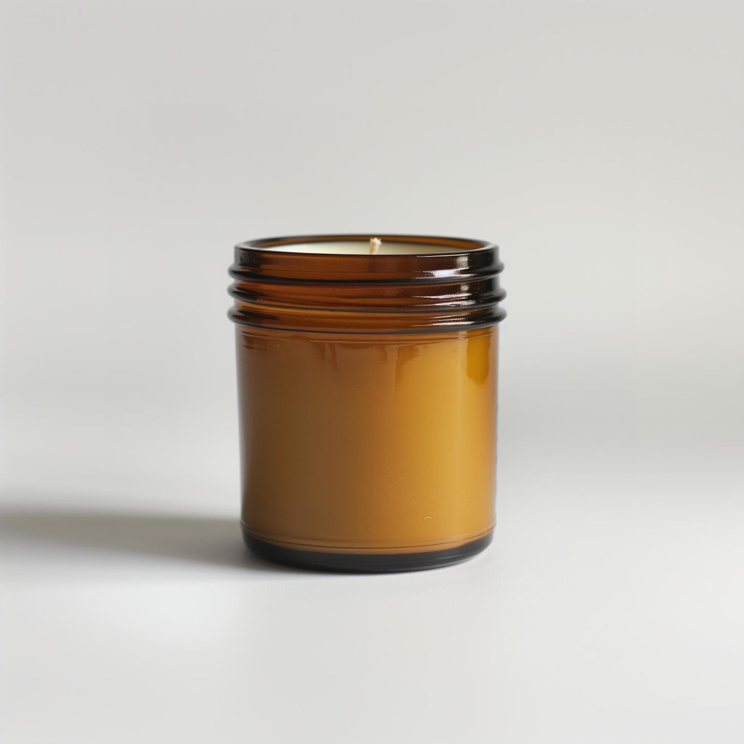 Set of COSYPLACE CANDLES in various sizes and scents, displayed on a wooden surface with warm, inviting lighting.
